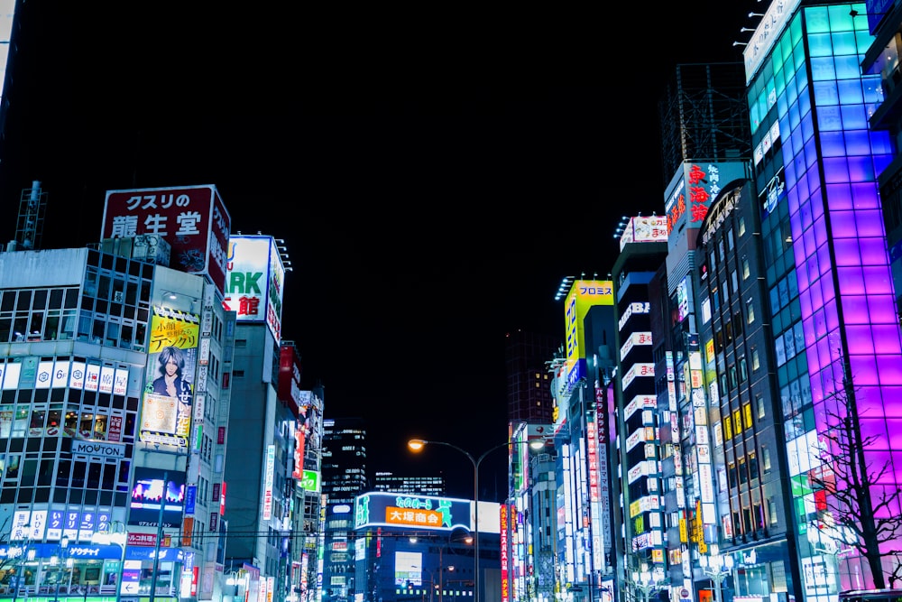 a city street filled with lots of tall buildings