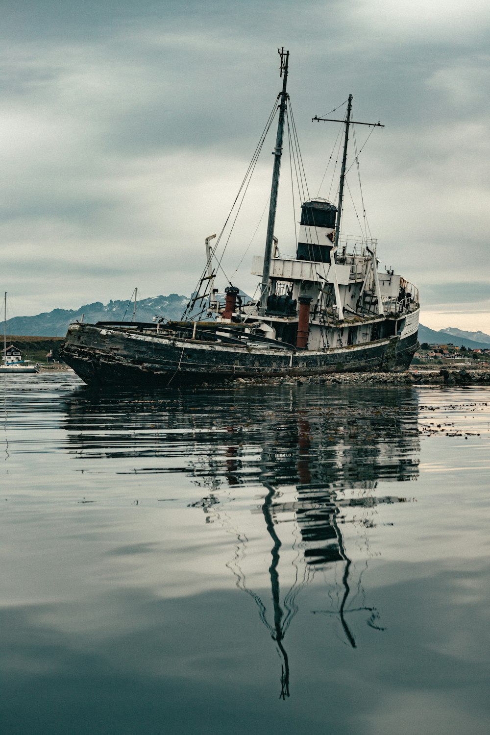 a large boat floating on top of a body of water