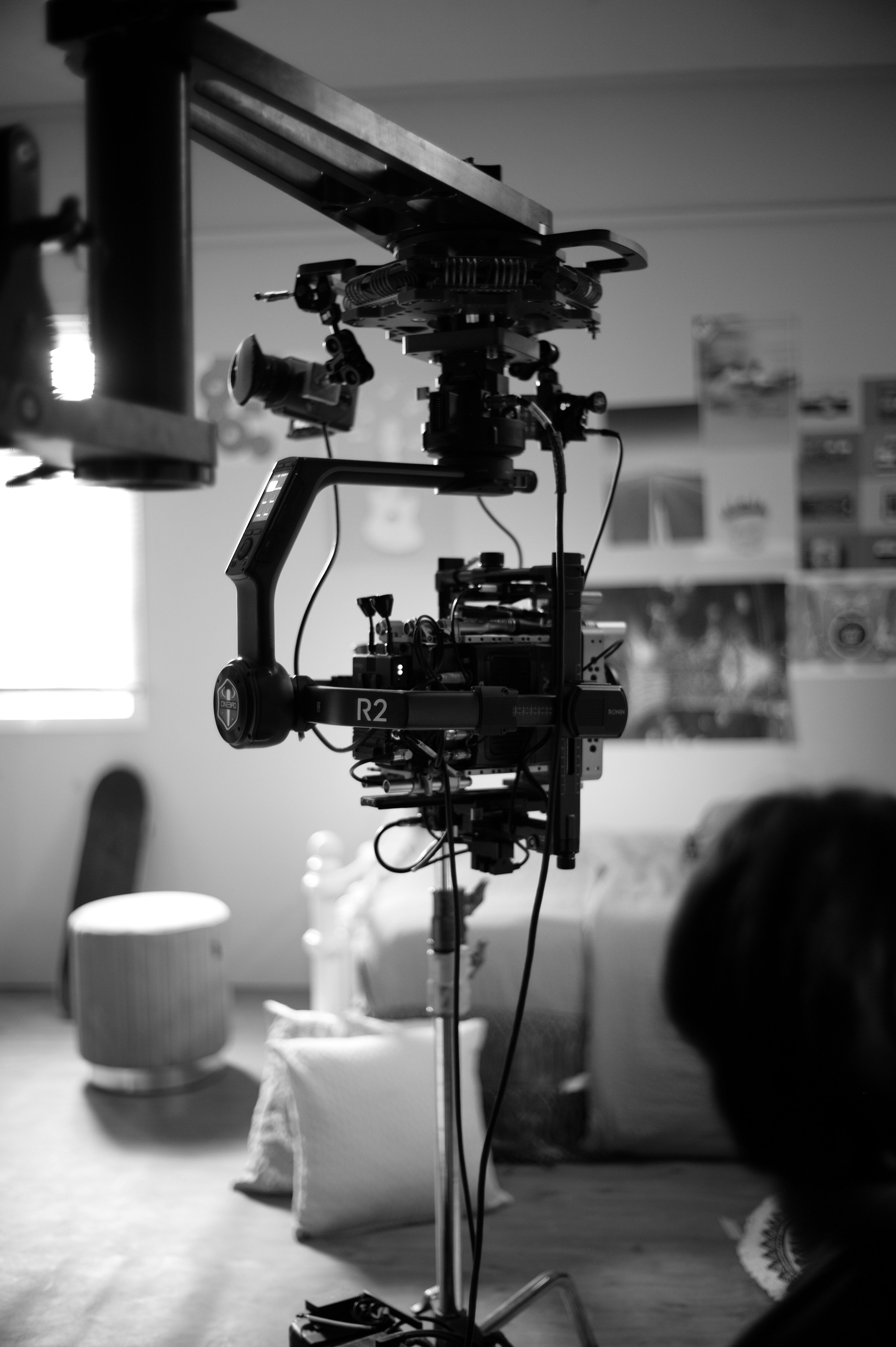 a black and white photo of a camera on a tripod