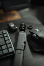 a keyboard, mouse, and other electronics on a table