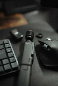 a keyboard, mouse, and other electronics on a table