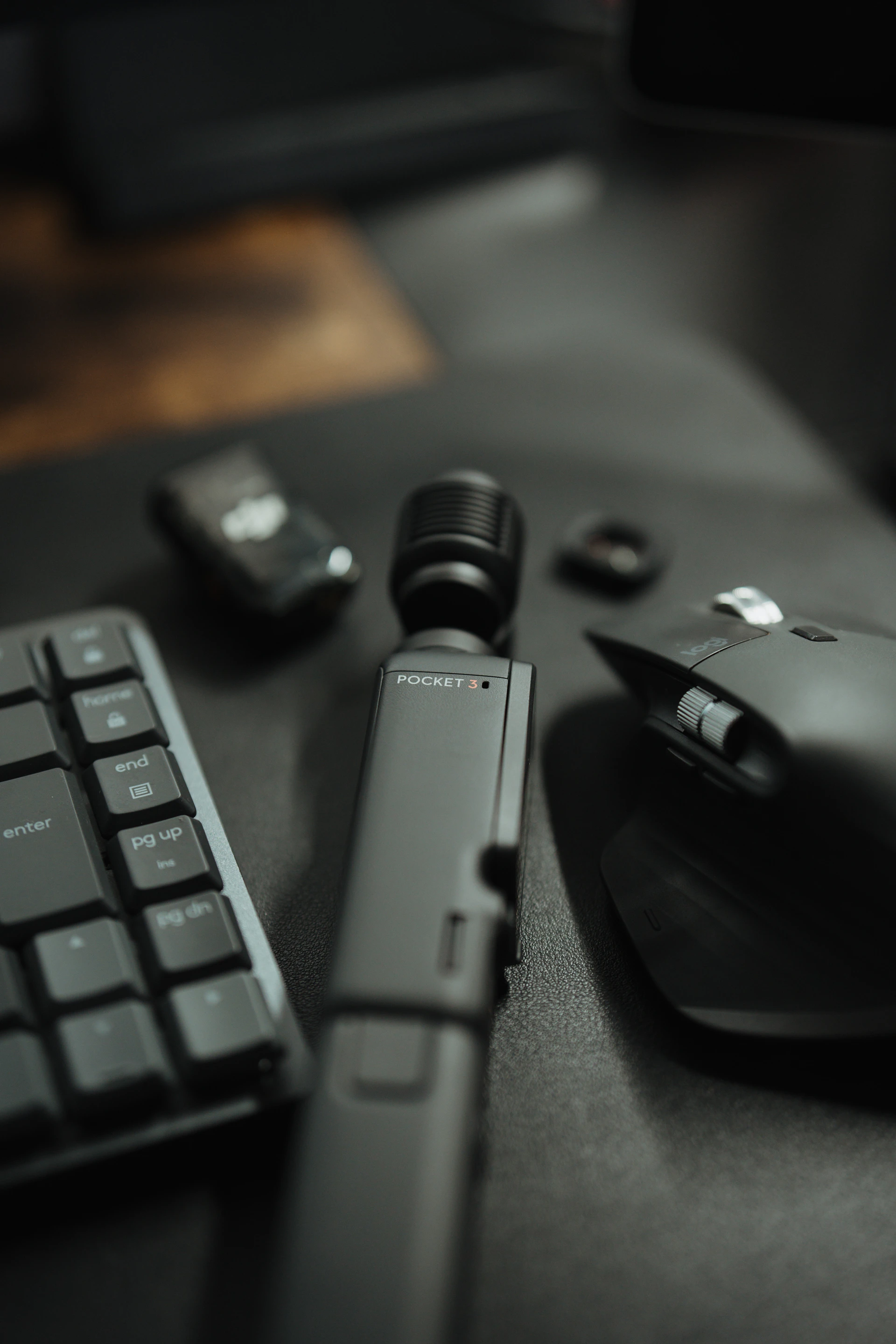 a keyboard, mouse, and other electronics on a table