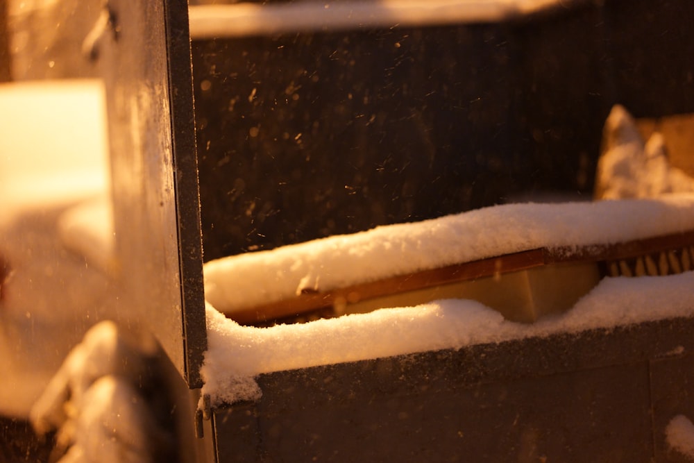 a close up of a snow covered window sill