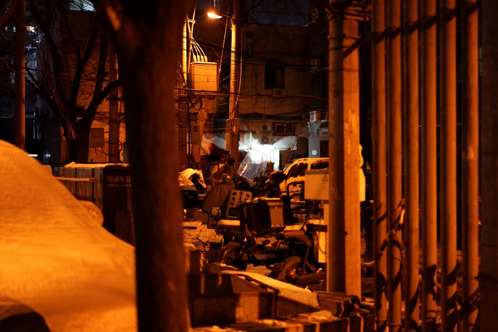 a group of people walking down a street at night