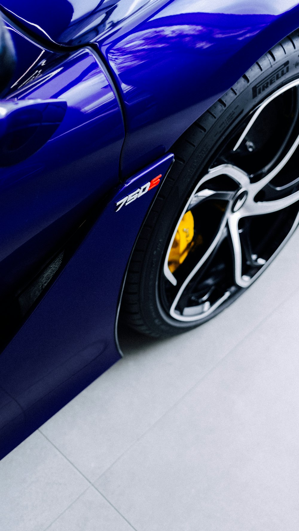 a blue sports car parked in a garage