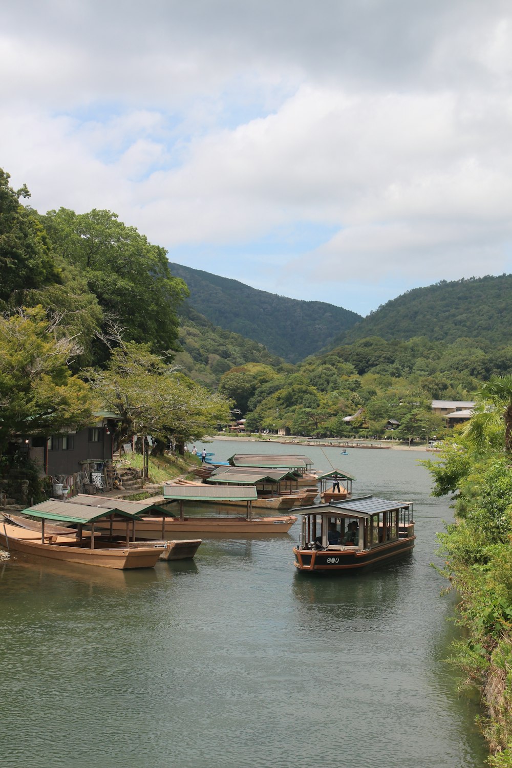 a group of boats floating on top of a river