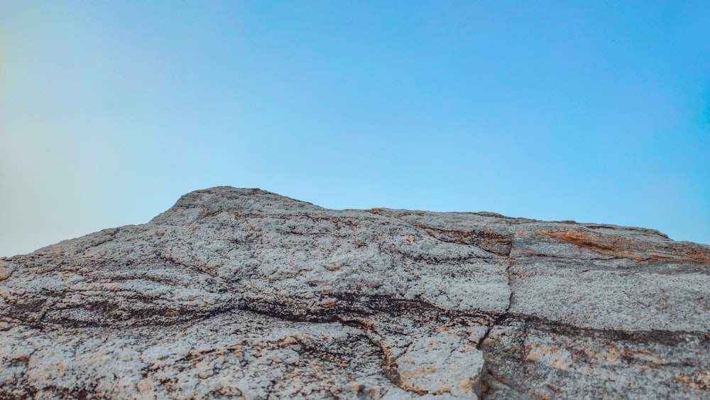 a view of a rock outcropping with a blue sky in the background