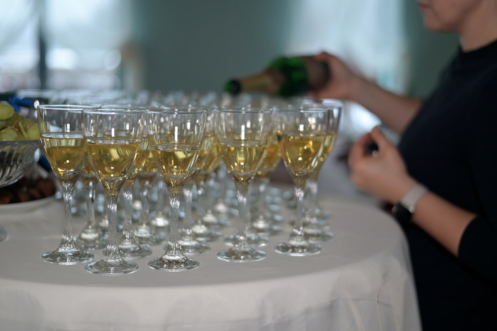 a bunch of wine glasses sitting on a table