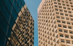 a couple of tall buildings next to each other