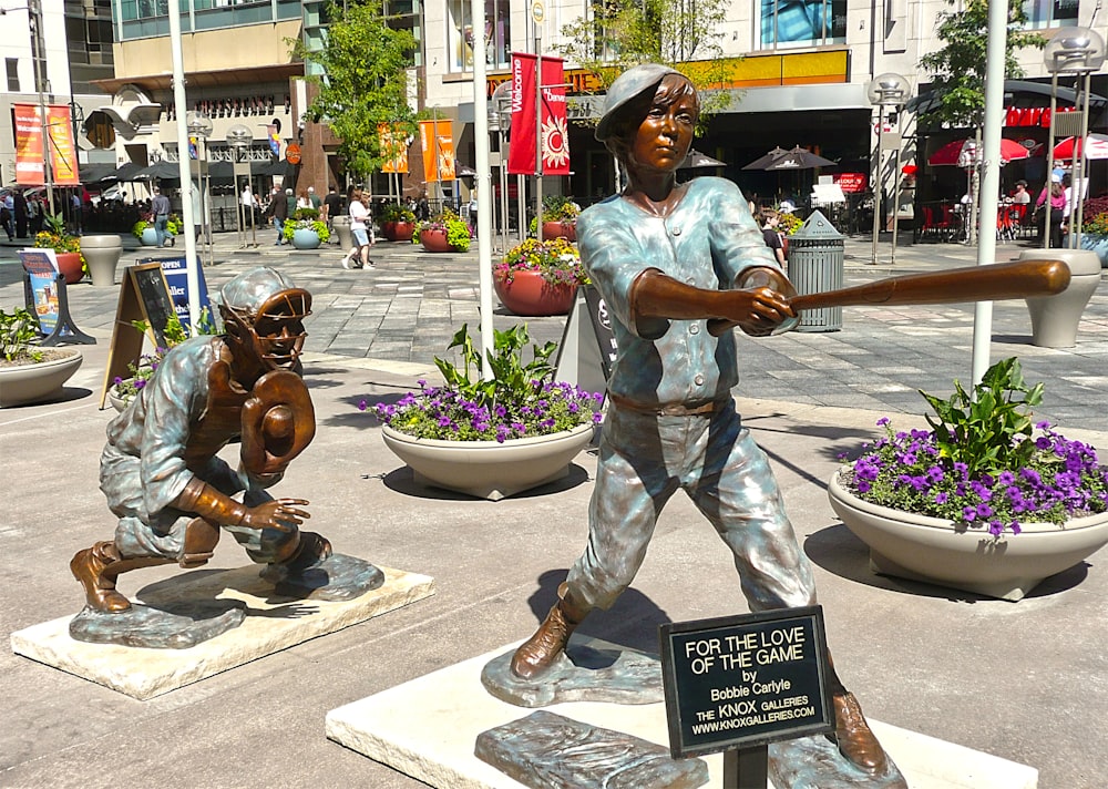 a statue of a baseball player swinging a bat