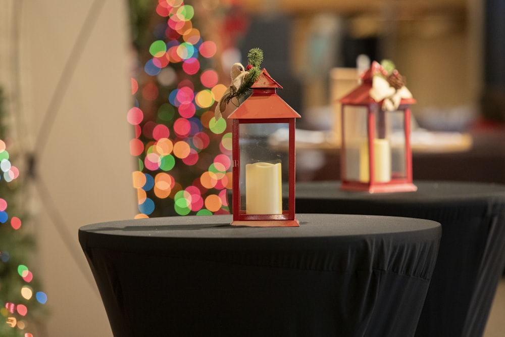 two red lanterns sitting on top of a table