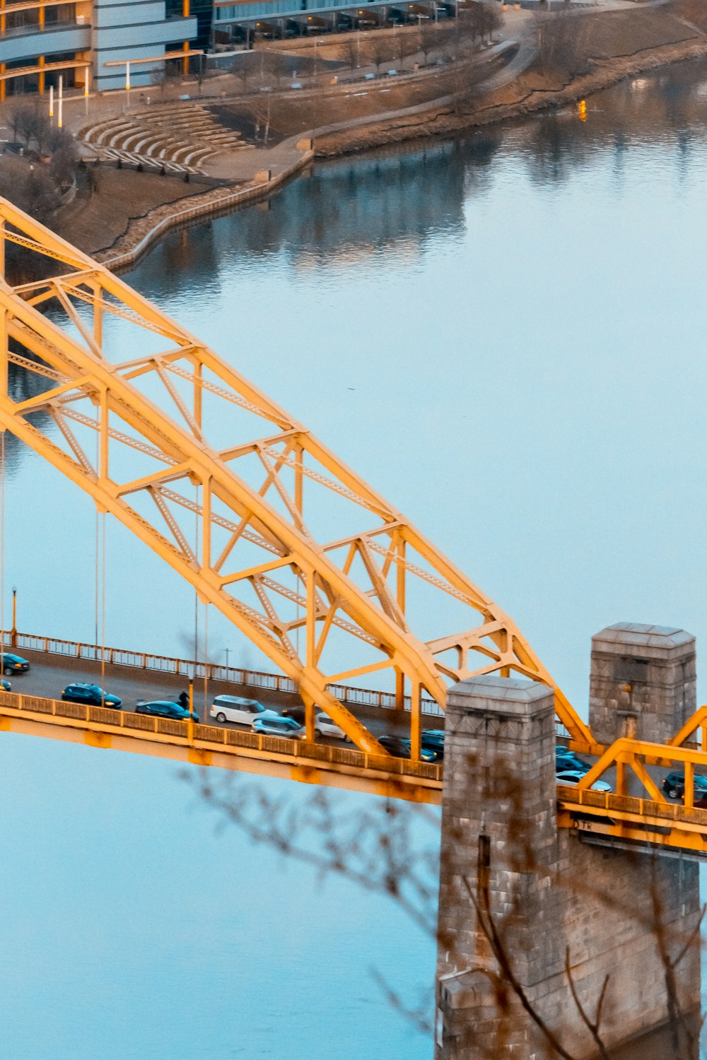 a bridge over a body of water with a train on it