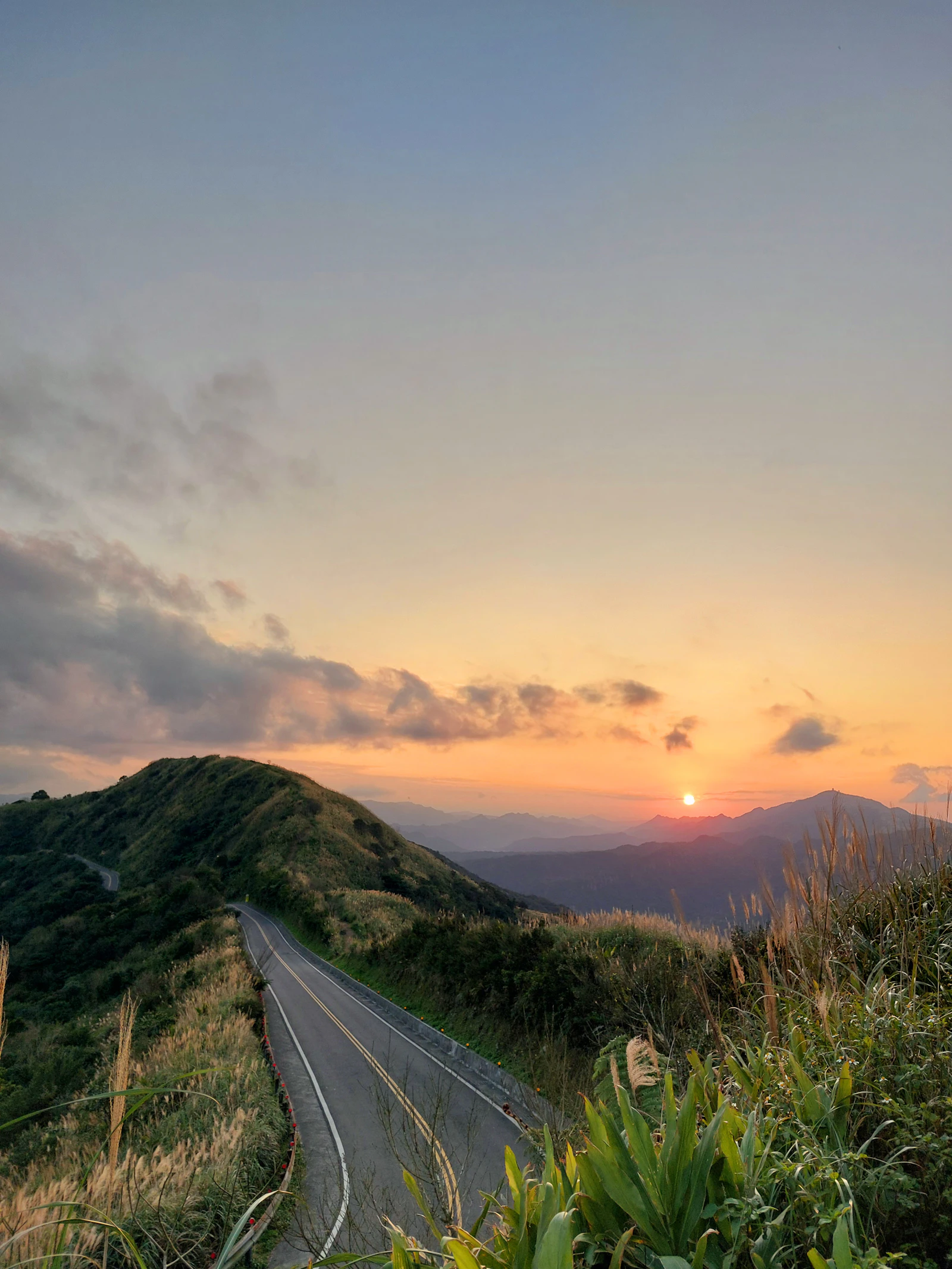 Mountain road and ridgelines at sunset in northern Taiwan