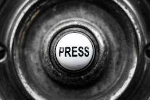 a button with the word press on it