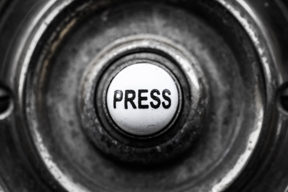 a button with the word press on it