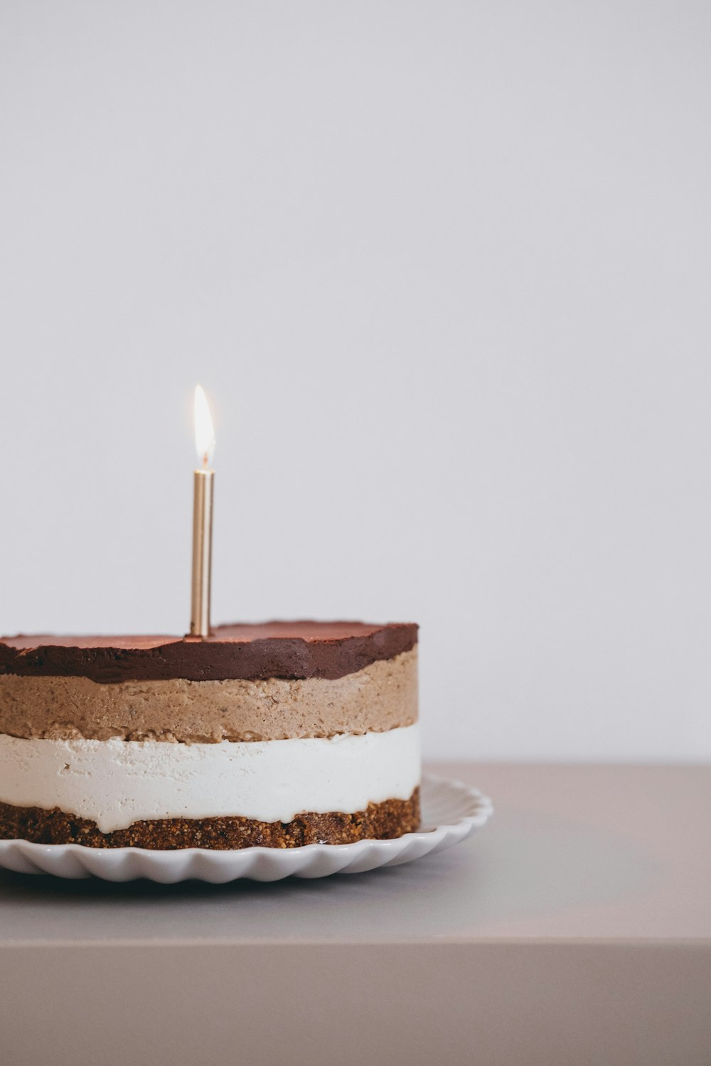 a cake with a single candle on top of it