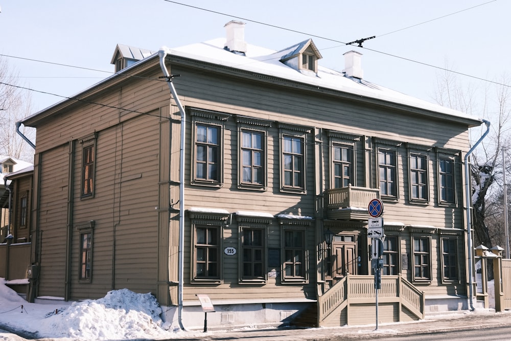 a building with a snow covered street in front of it