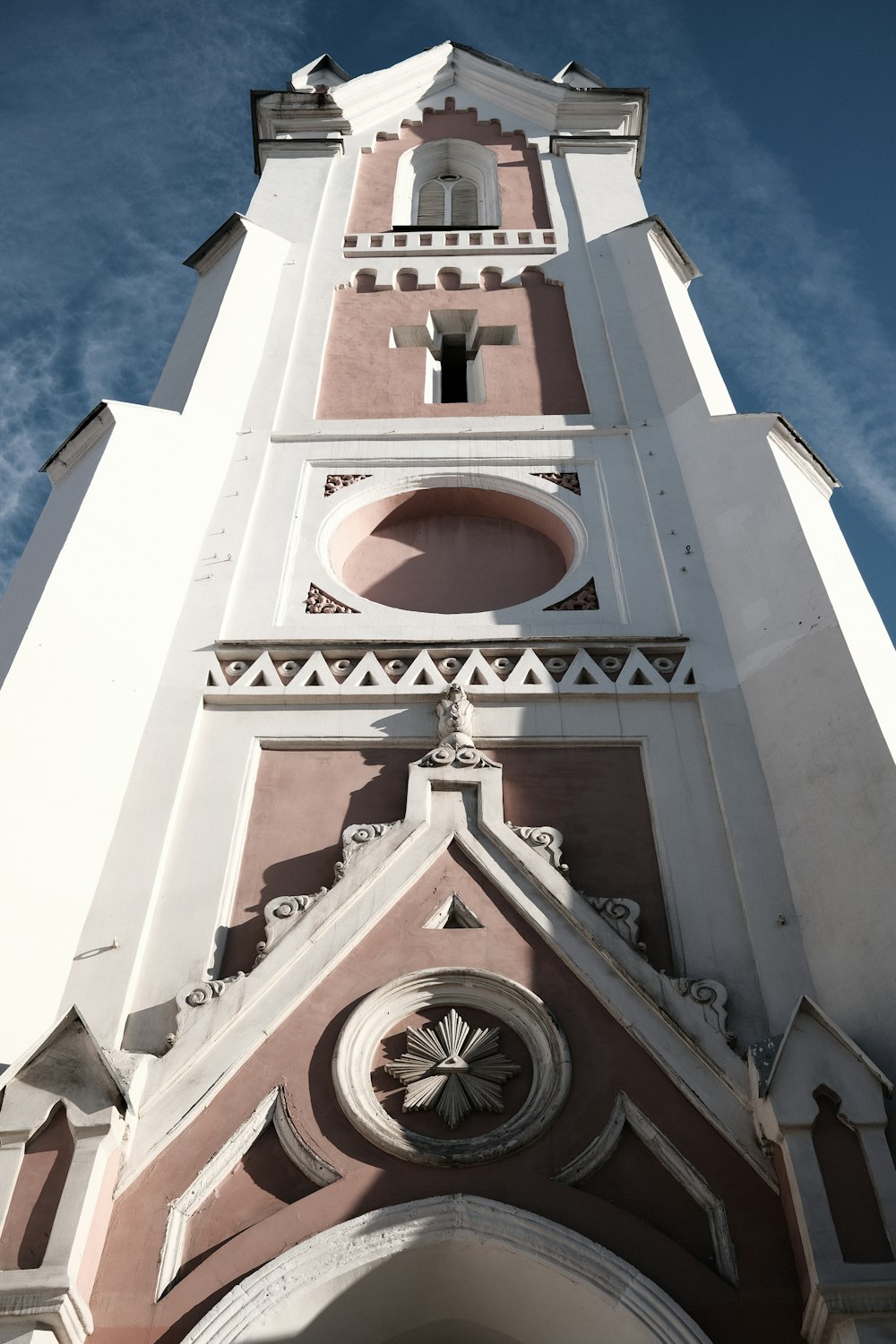 a tall tower with a clock on the top of it