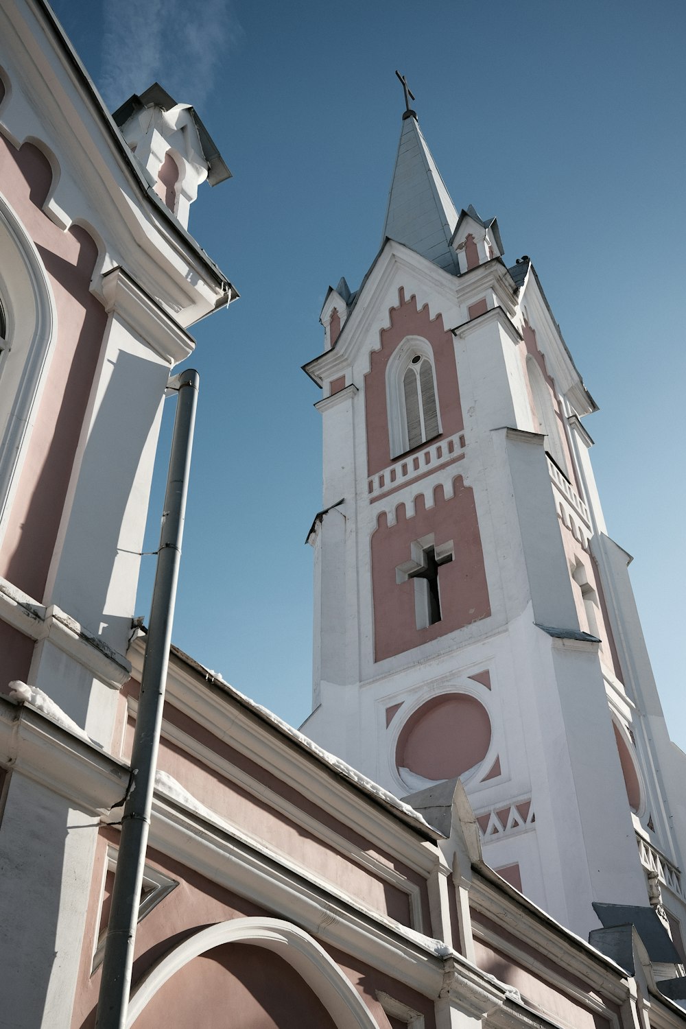 a church steeple with a cross on it