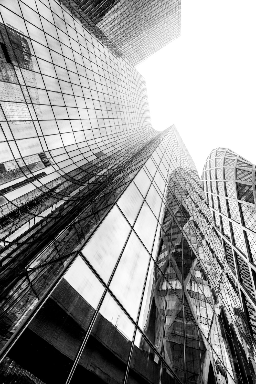 a black and white photo of some very tall buildings