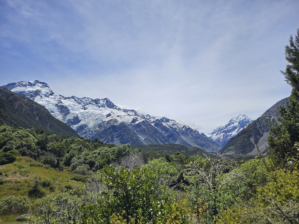 a view of a mountain range with snow on it