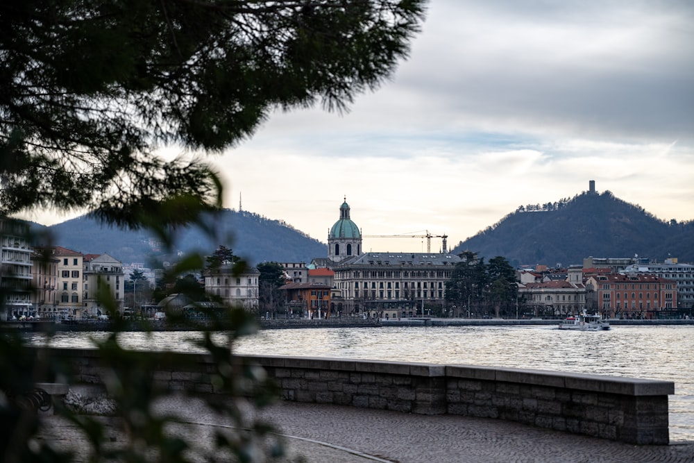 a view of a large body of water with buildings in the background