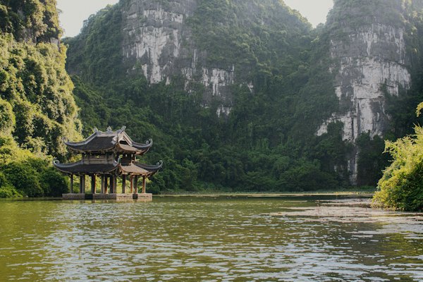 A lake with a pavilion in the middle of it — Ninh Bình, Vietnam