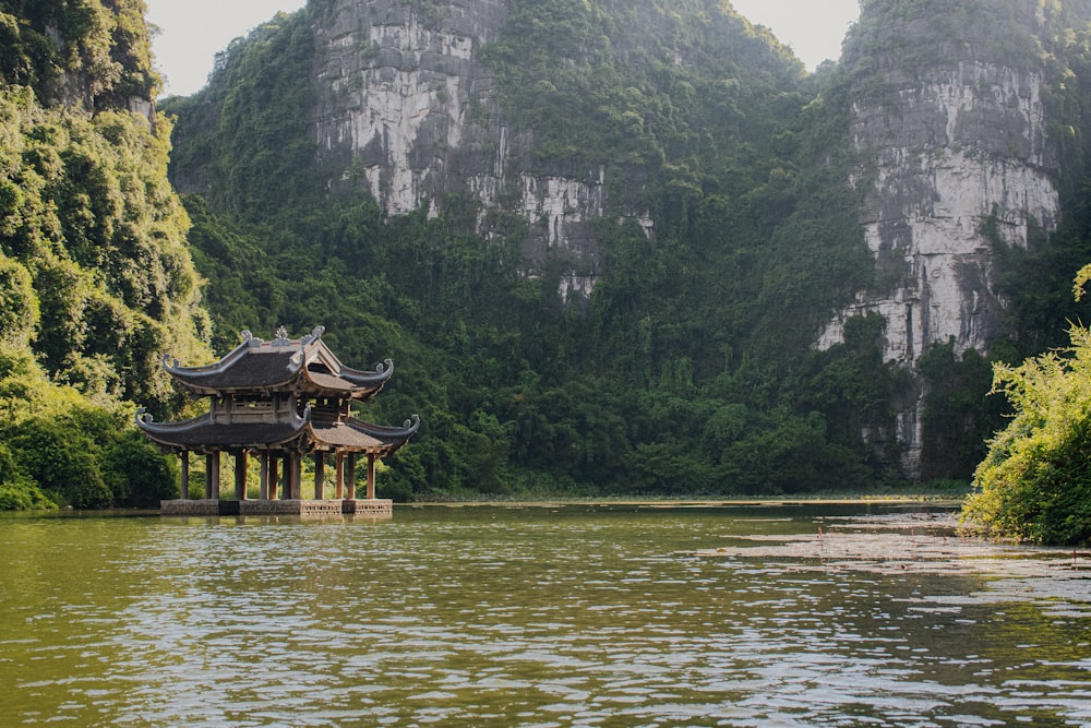 a lake with a pavilion in the middle of it