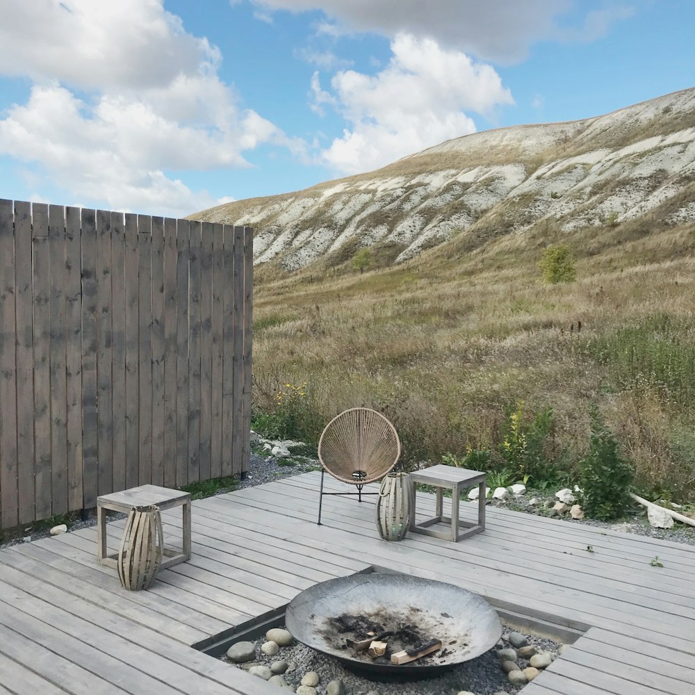 a fire pit sitting on top of a wooden deck