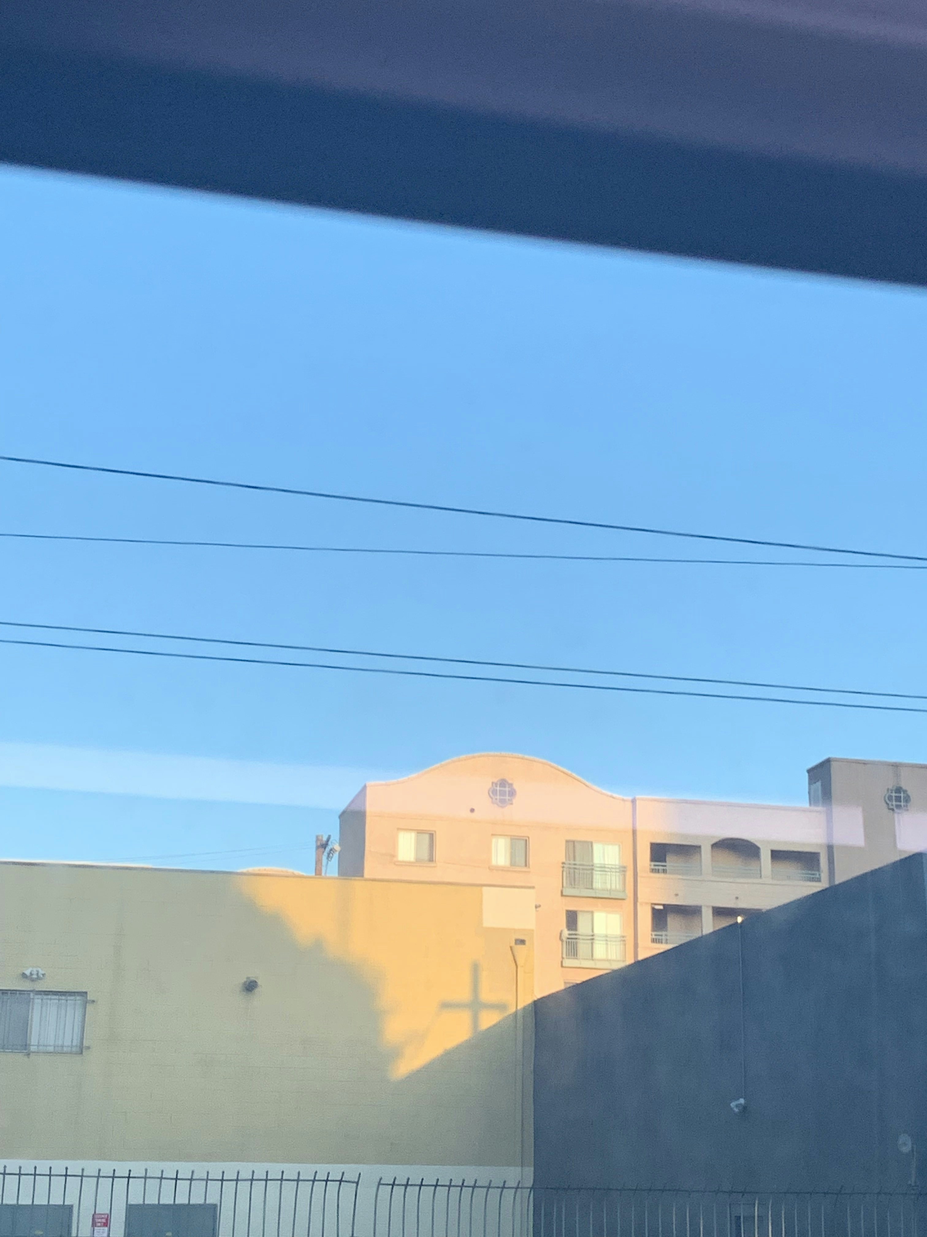 A view of a building through a window photo – Free Nature Image on Unsplash