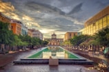 a city square with a fountain in the middle of it