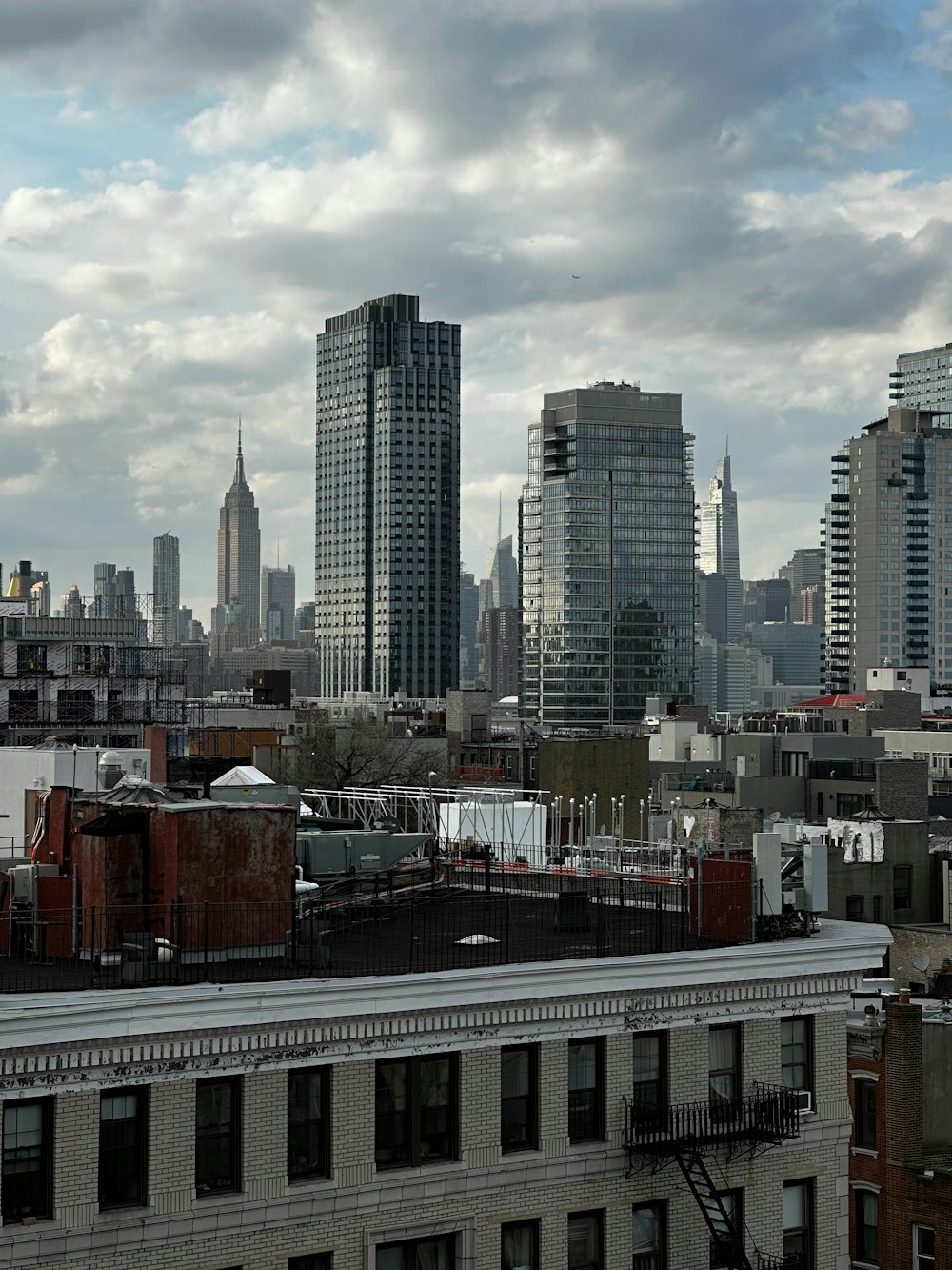 a view of a city skyline from a rooftop