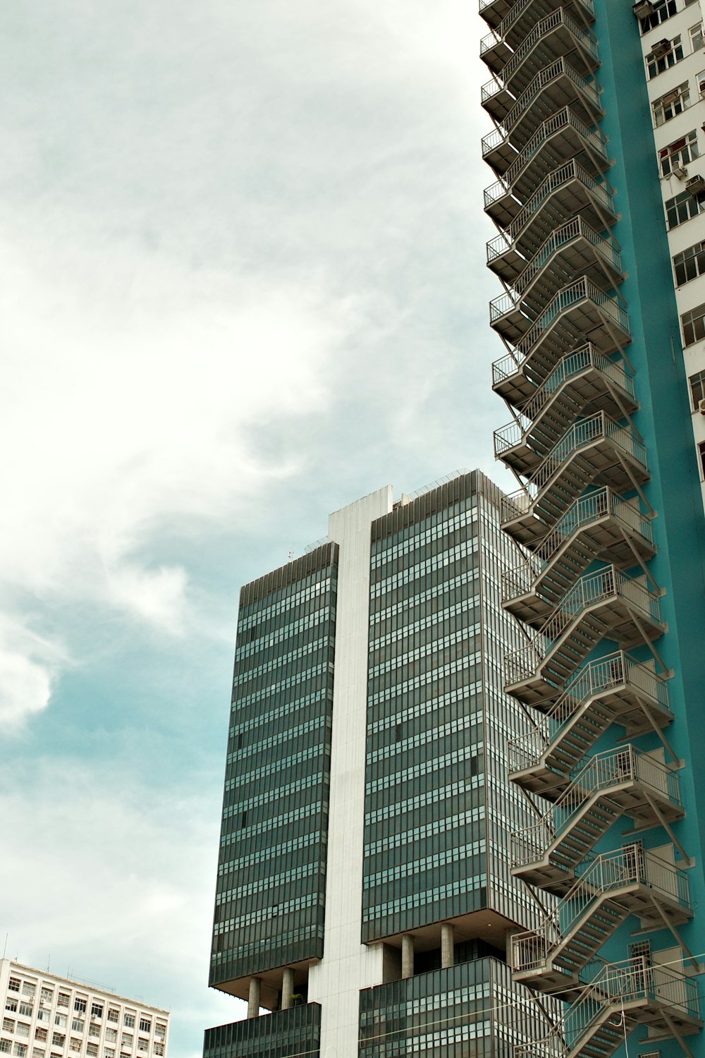 a very tall building next to a very tall building