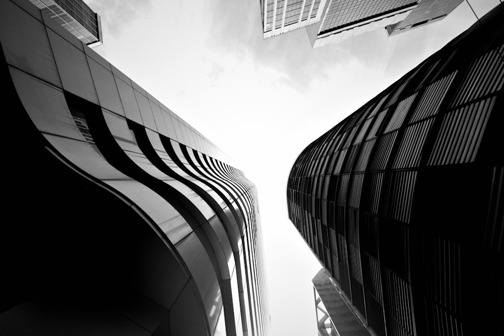 a black and white photo of two tall buildings