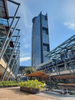a tall building with a fountain in front of it