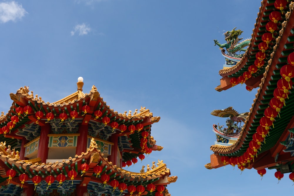 the roof of a chinese building with a sky background