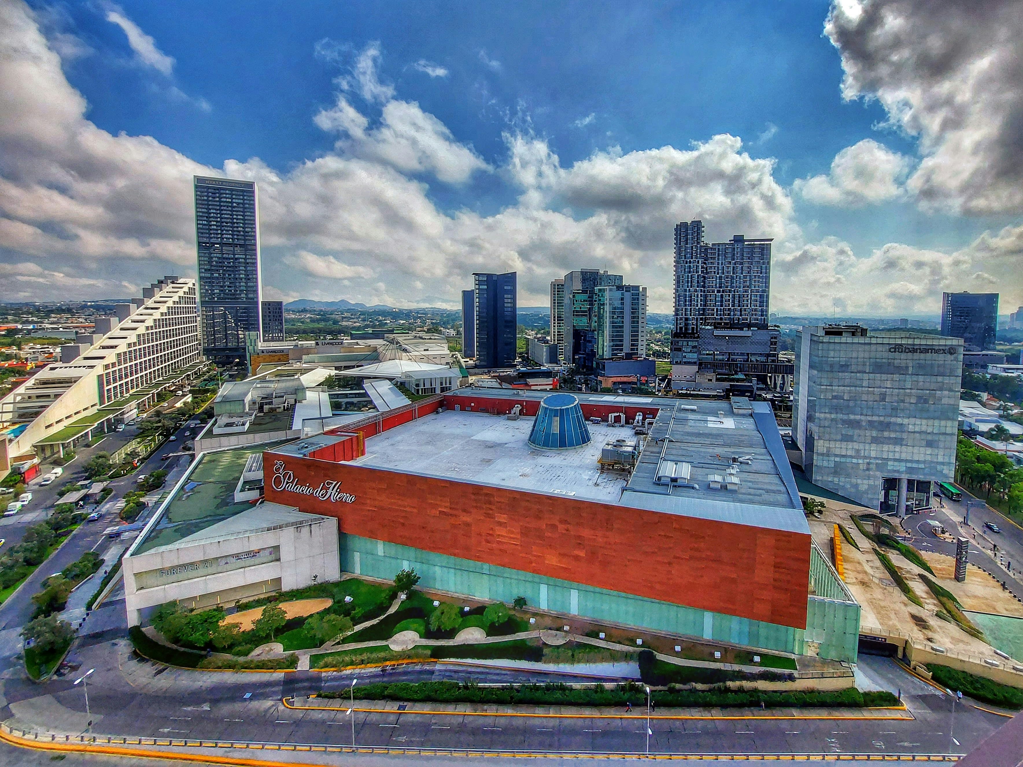 an aerial view of a large building with a sky background