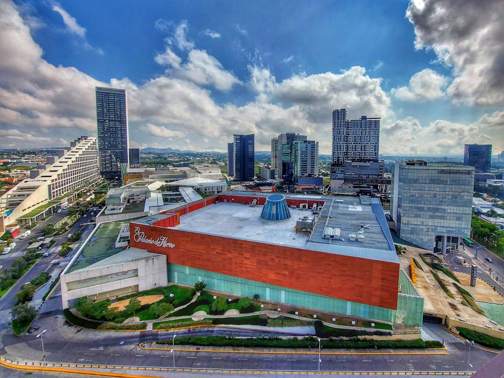 an aerial view of a large building with a sky background