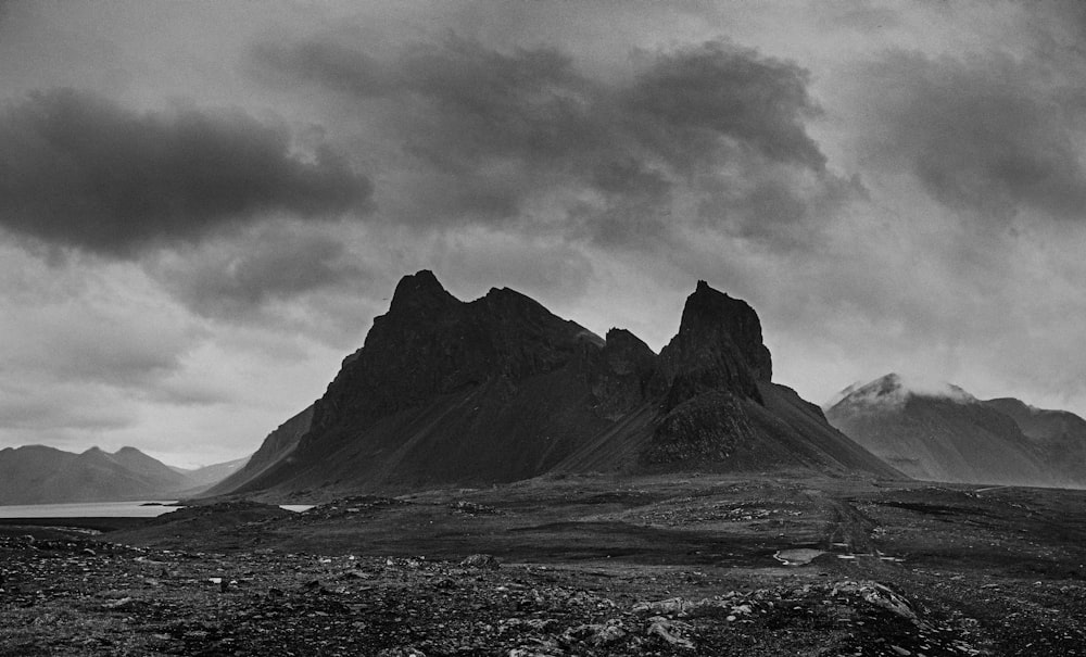 a black and white photo of a mountain range