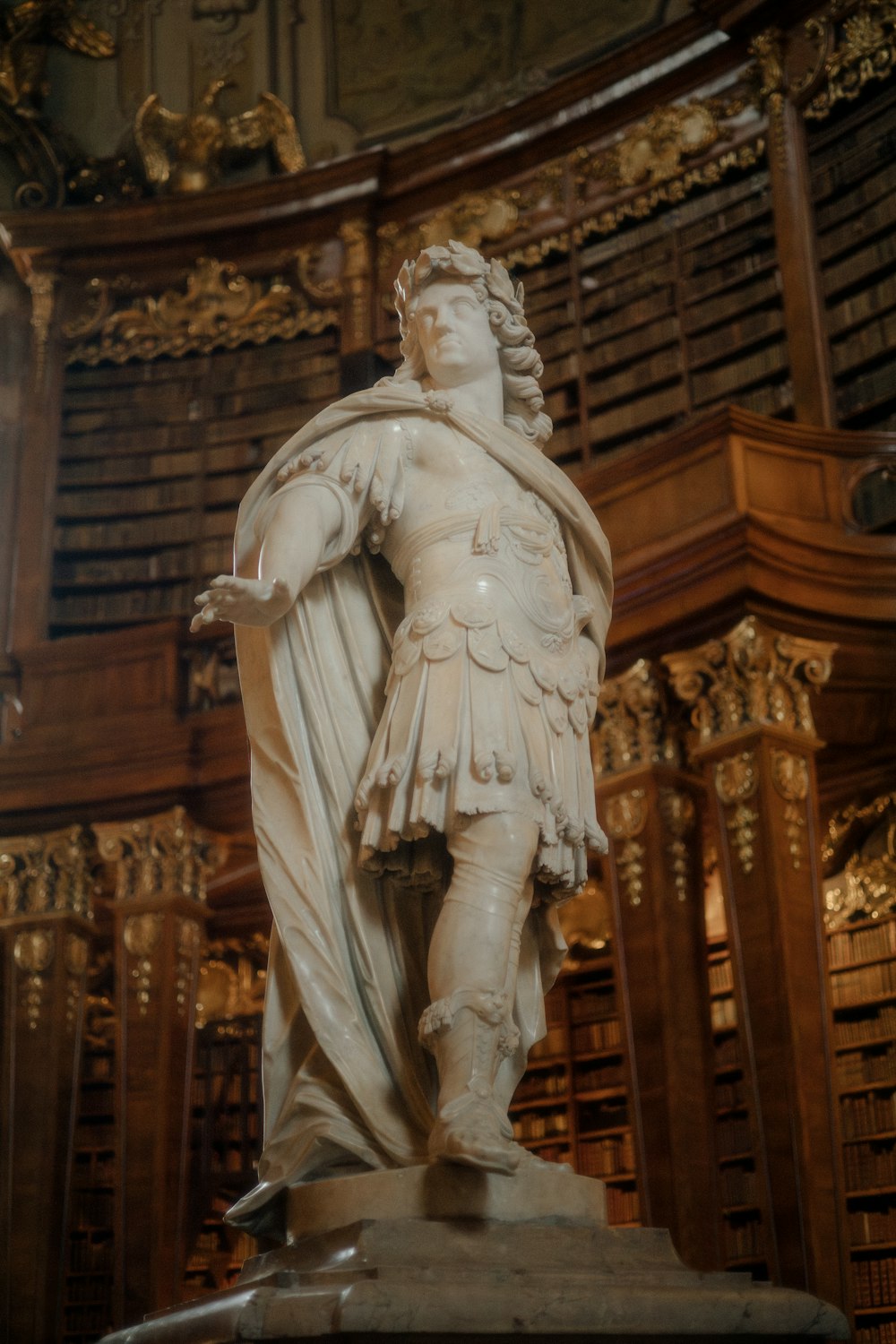 a statue of a man in a library