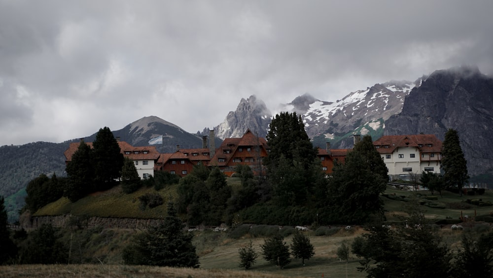 a large building sitting on top of a lush green hillside