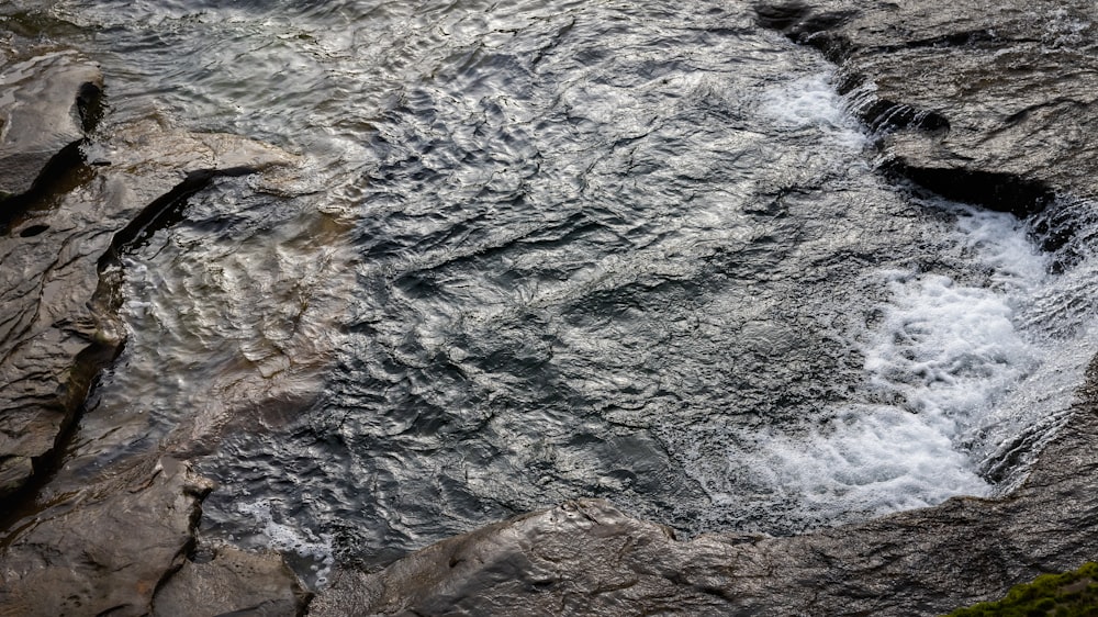a stream of water running between two rocks
