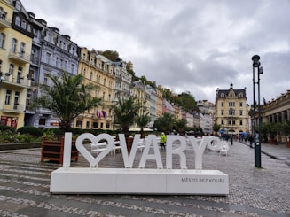a sign that says i love varry in front of a row of buildings