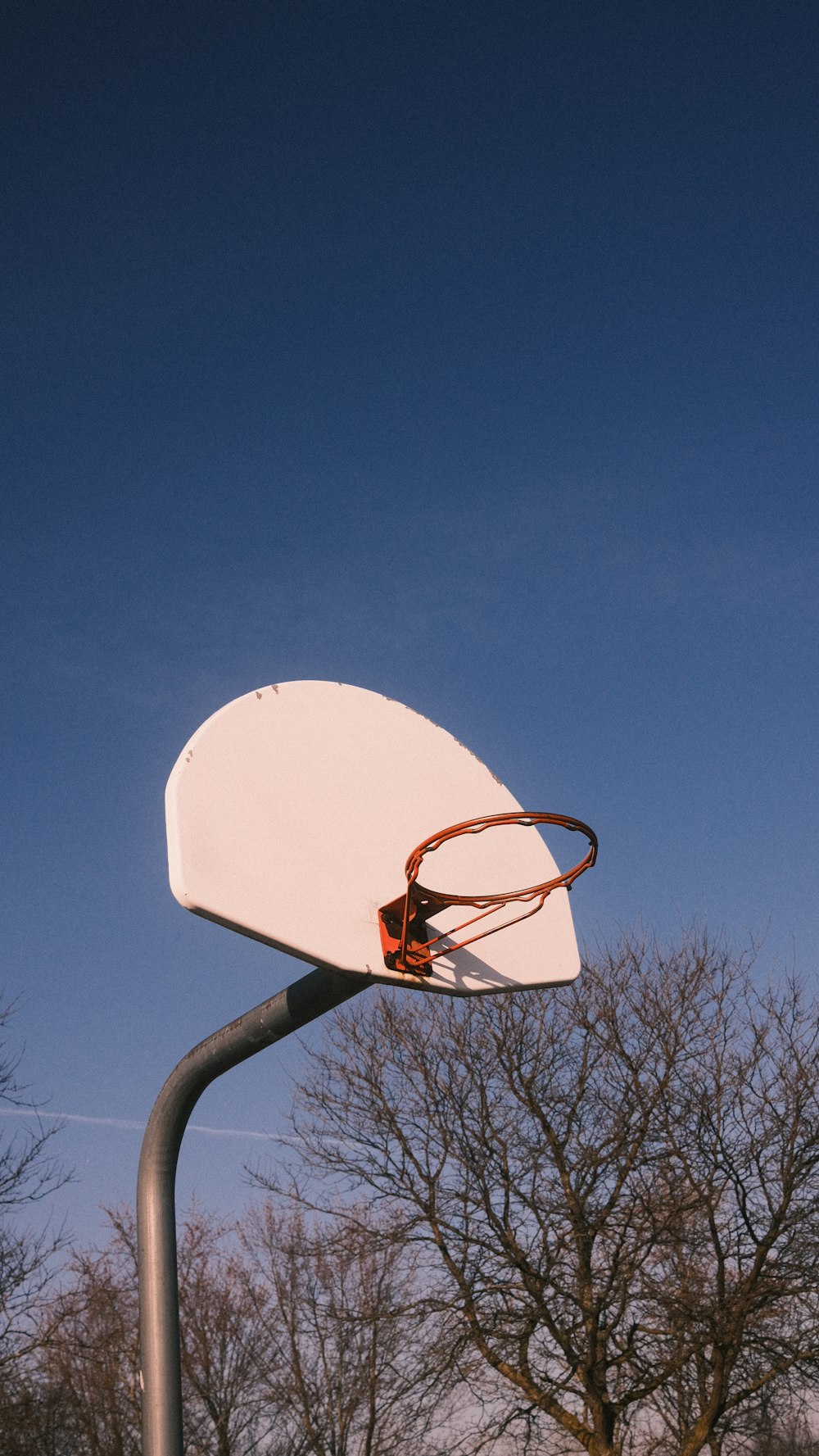 a basketball hoop with a basketball hanging from it