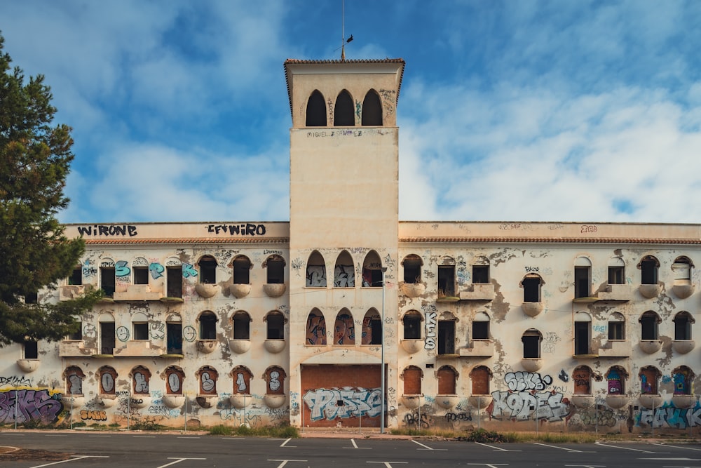 an old building with graffiti on the side of it