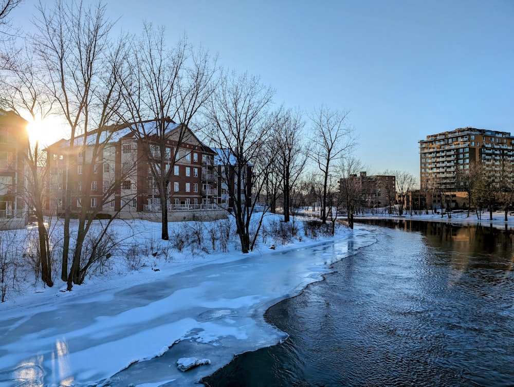 a river running through a snow covered park