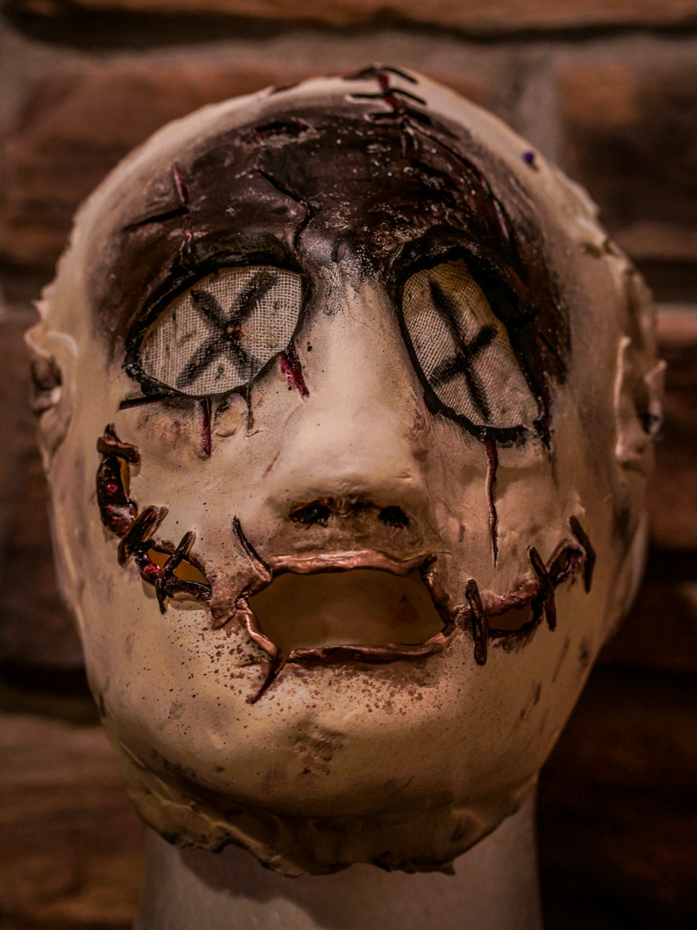 a close up of a creepy looking face on a mannequin