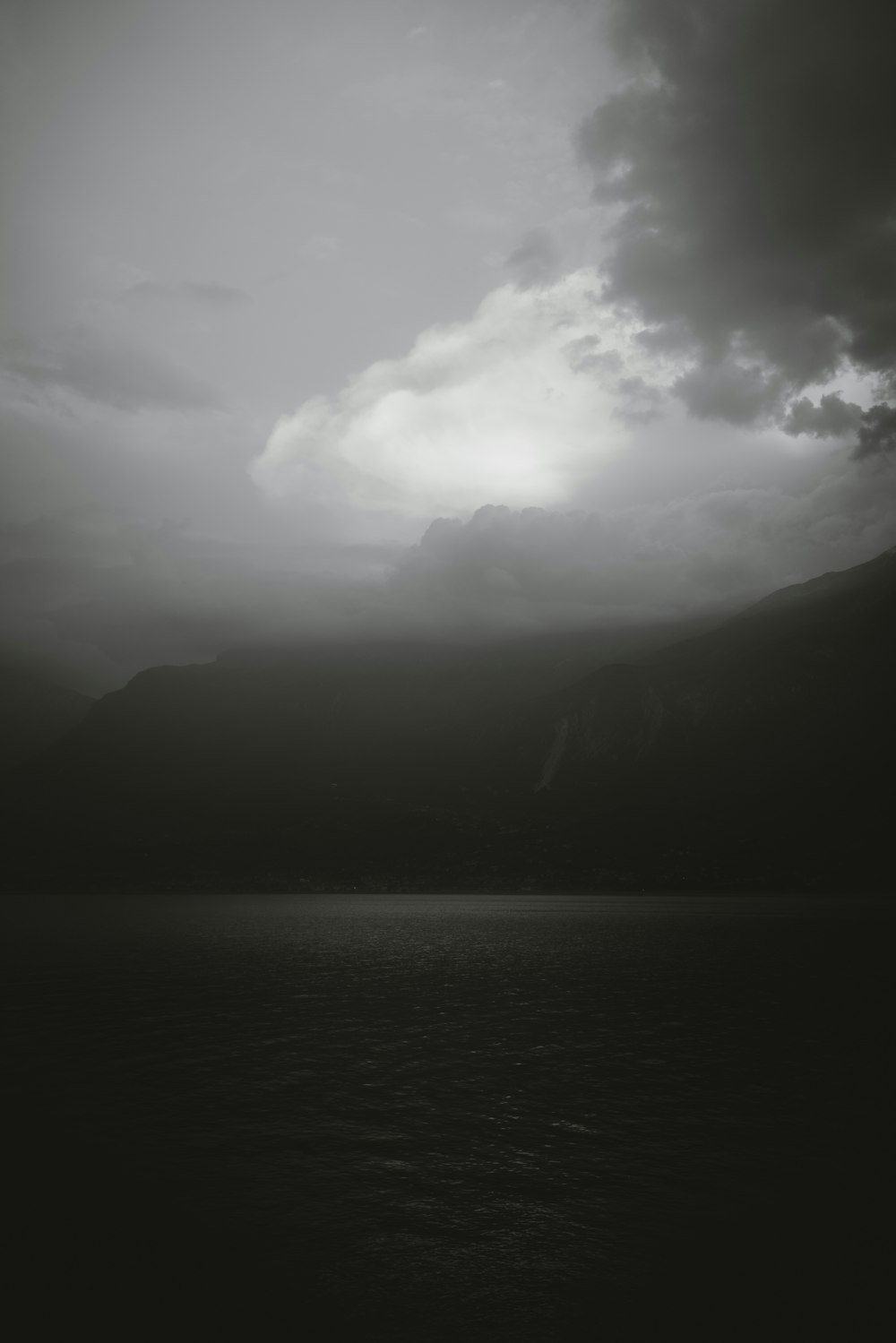 a black and white photo of a body of water