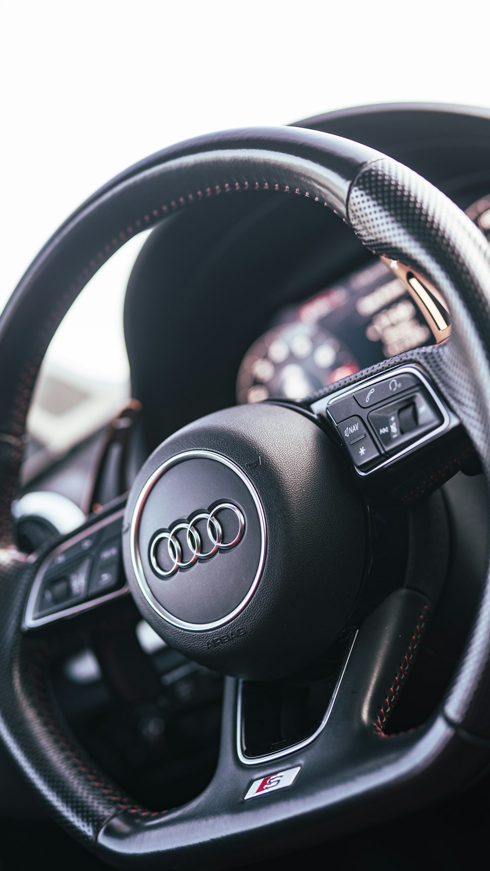 a steering wheel and dashboard of a car