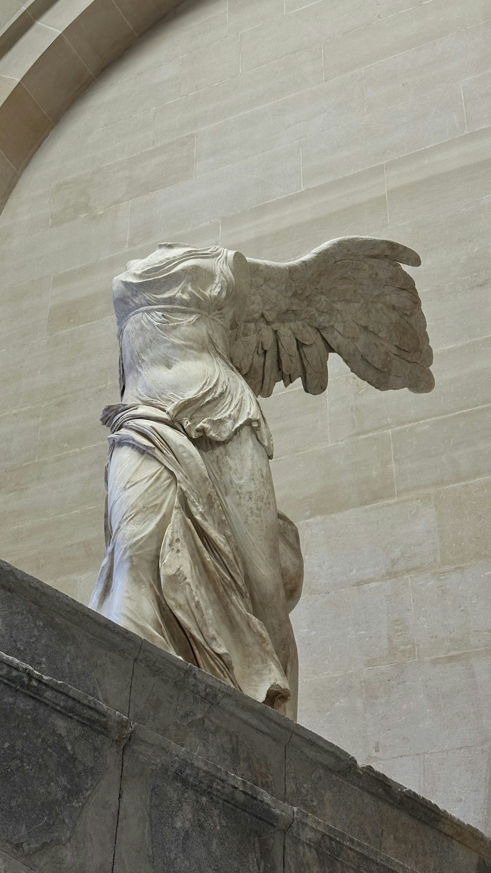 a statue of an angel on a ledge